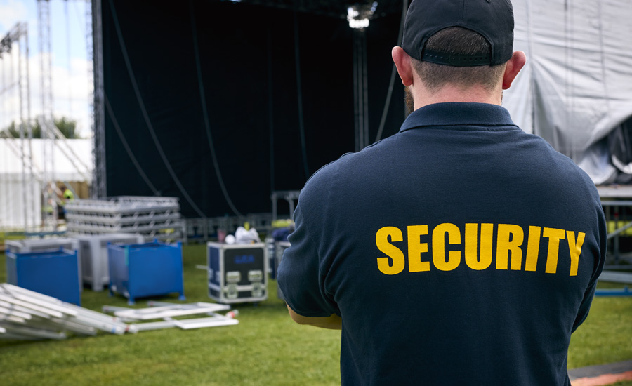Event-Security Male security guard watches over event setup