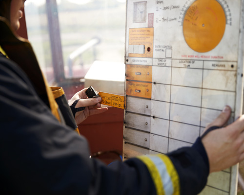 FireWatch_PublicSafety Officer monitors fire status.